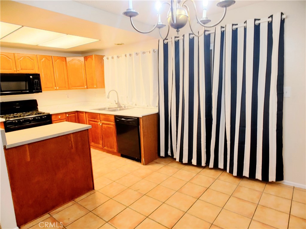 49409 Eisenhower Drive Indio, CA 92201 - Photo 21 of 30 a view of kitchen with wooden floor