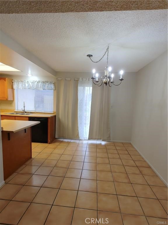 49409 Eisenhower Drive Indio, CA 92201 - Photo 25 of 30 a view of a kitchen with a sink and cabinets