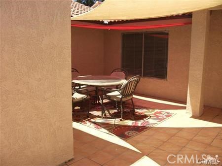 49409 Eisenhower Drive Indio, CA 92201 - Photo 30 of 30 a patio with table and chairs