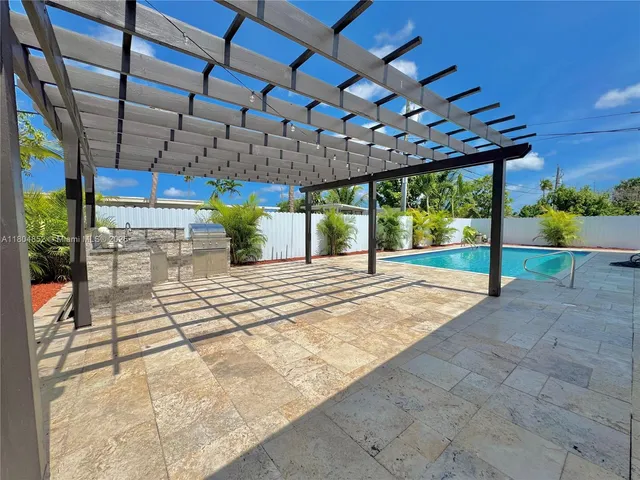 a view of a garage with a table and chairs