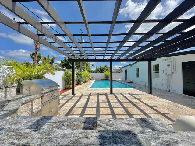 a view of swimming pool from a balcony