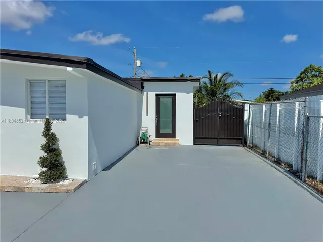 a kitchen with stainless steel appliances granite countertop a refrigerator and a microwave