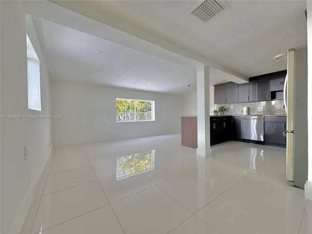 a view of a kitchen with a sink