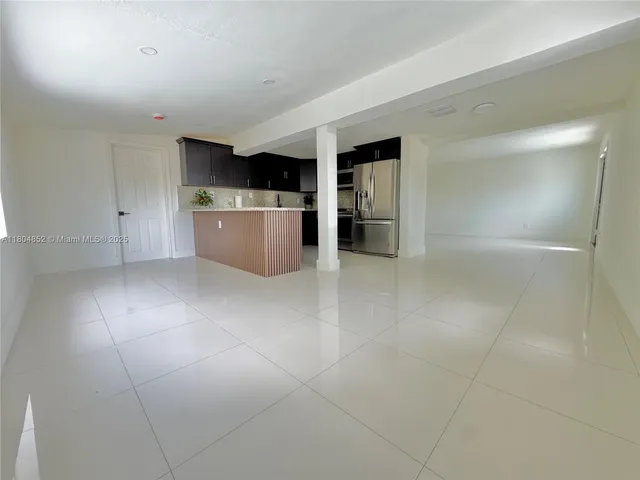 a view of a kitchen from a stairs