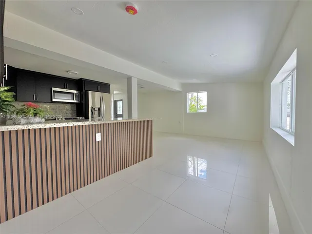 a view of a kitchen from a stairs
