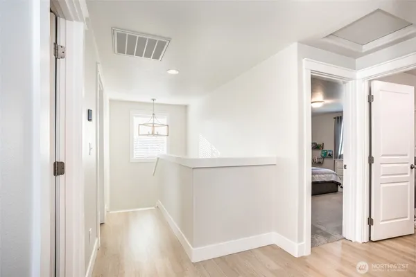 a view of entryway with wooden floor