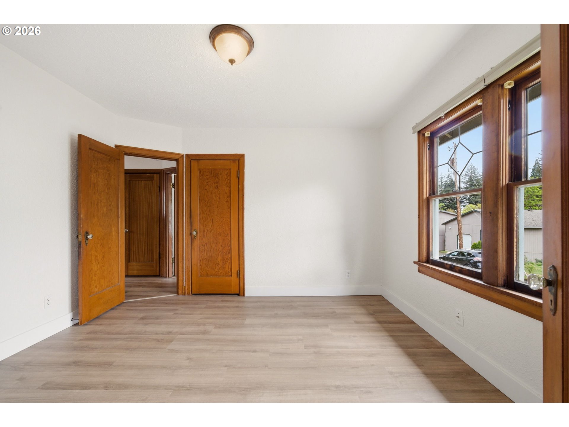 1804 Division Street Camas, WA 98607 - Photo 25 of 43 a view of an empty room with wooden floor and a window