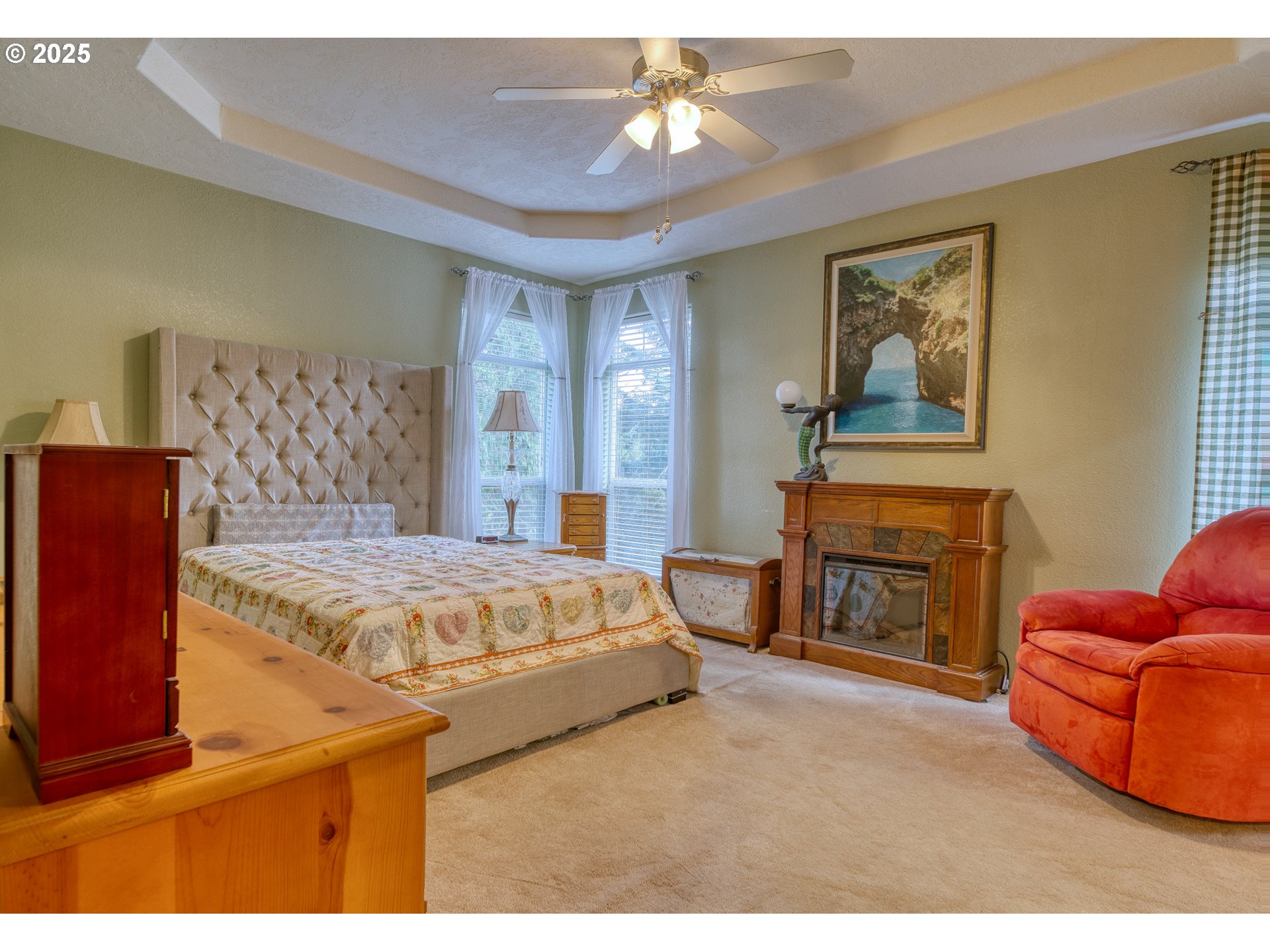 32673 Pittsburg Road St. Helens, OR 97051 - Photo 28 of 47 a spacious bedroom with a bed and dresser with mirror