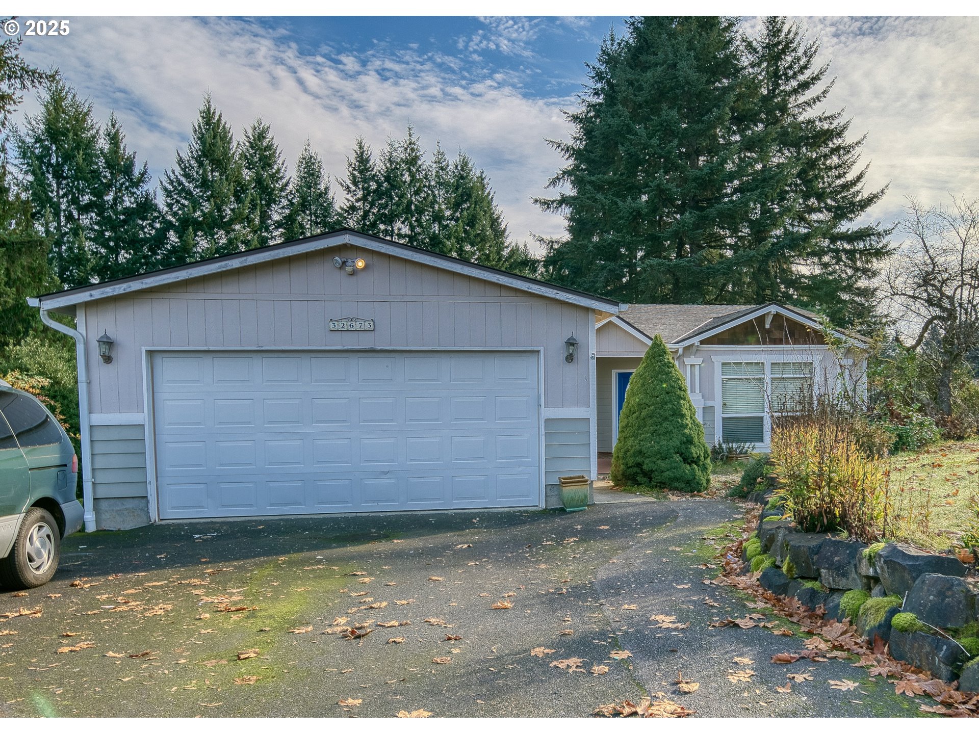 32673 Pittsburg Road St. Helens, OR 97051 - Photo 5 of 47 a front view of a house with a yard