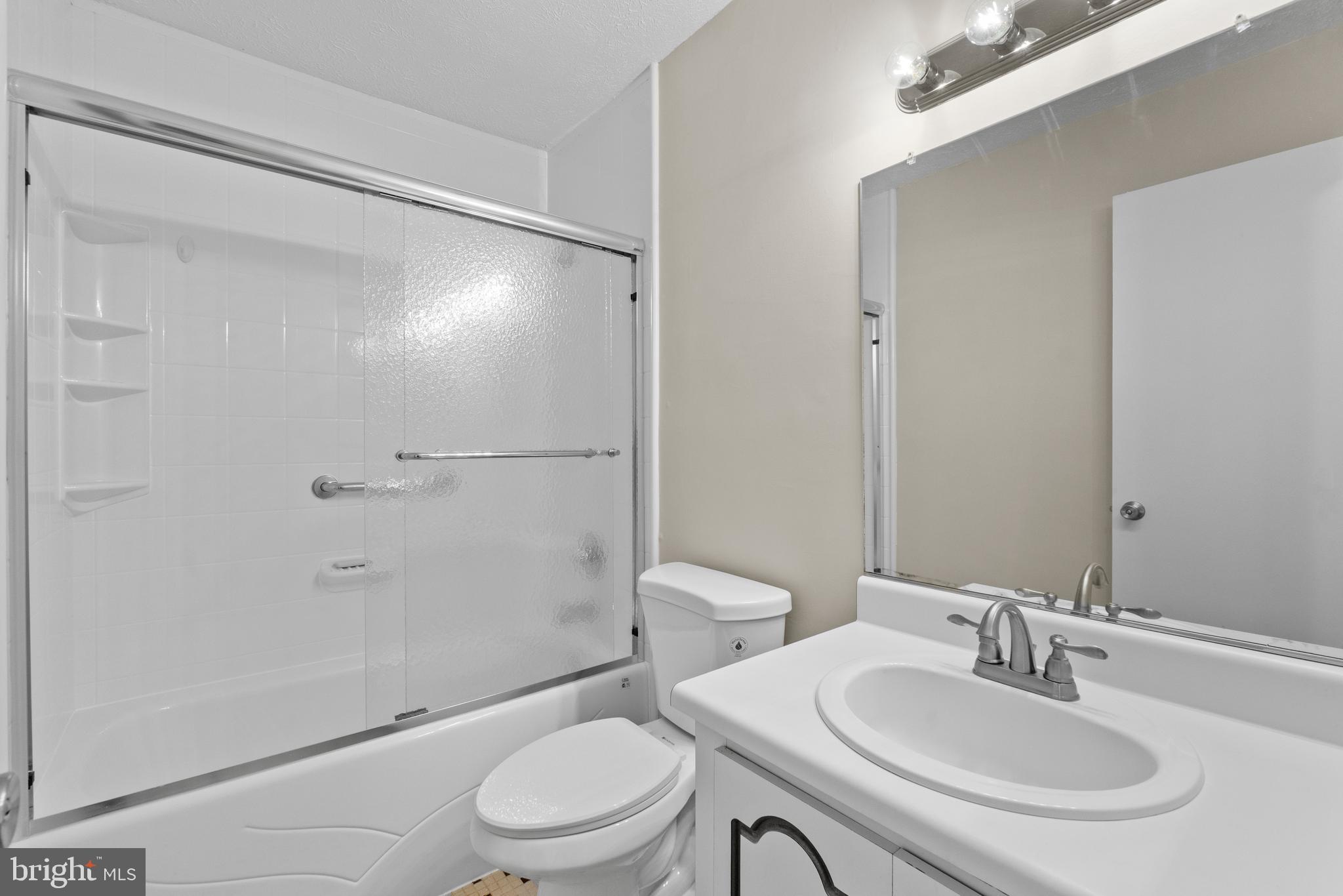 8617 Sherington Road Nottingham, MD 21236 - Photo 14 of 36 Full Hall Bath With Updated Glass Door Tub Shower