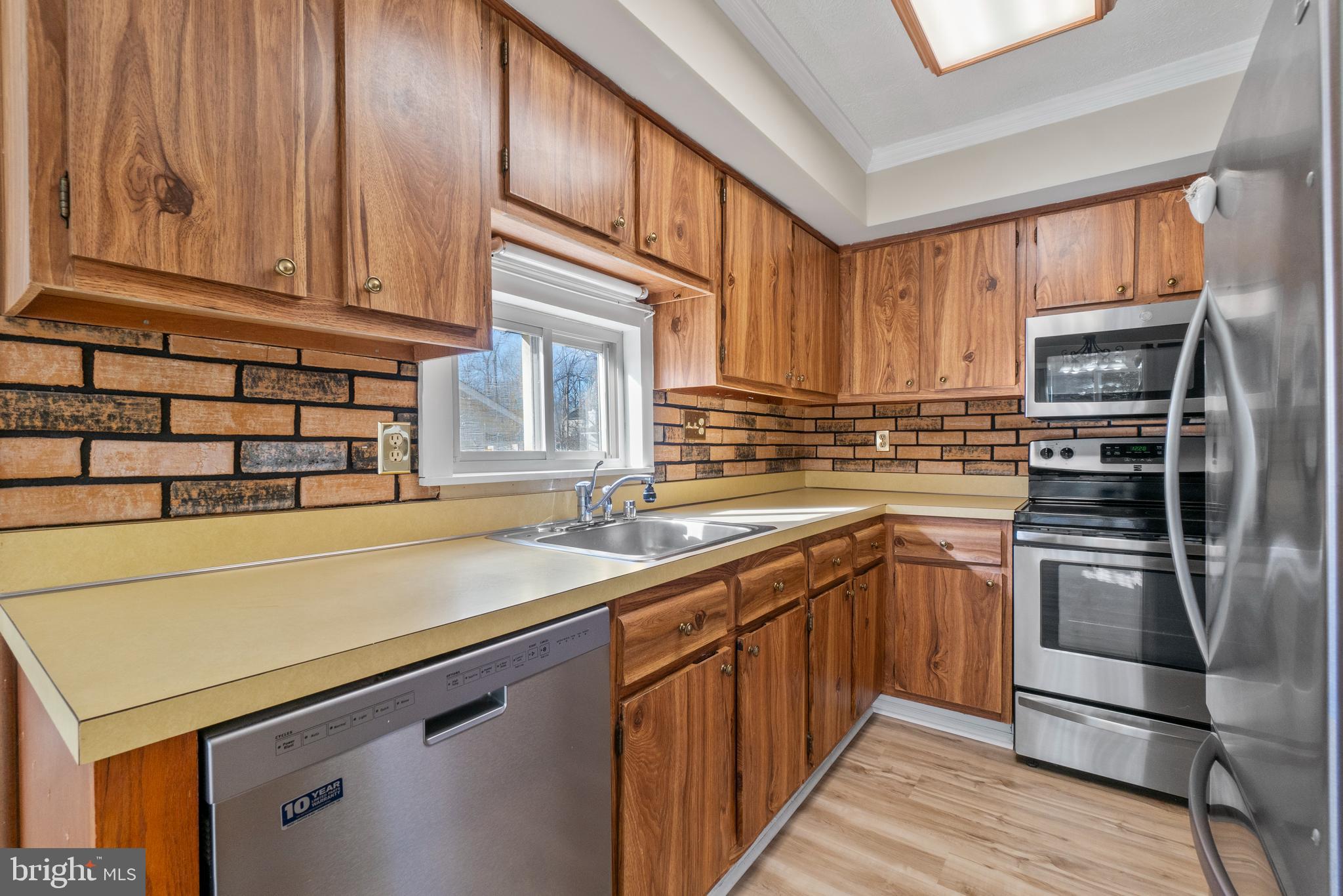 8617 Sherington Road Nottingham, MD 21236 - Photo 6 of 36 Kitchen With NEW Luxury Vinyl Plank Floor