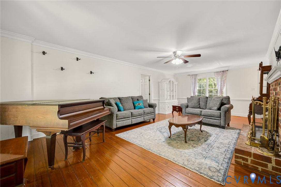 2409 Three Bridge Road Powhatan, VA 23139 - Photo 14 of 39 Hardwood flooring, crown molding, brick fireplace,