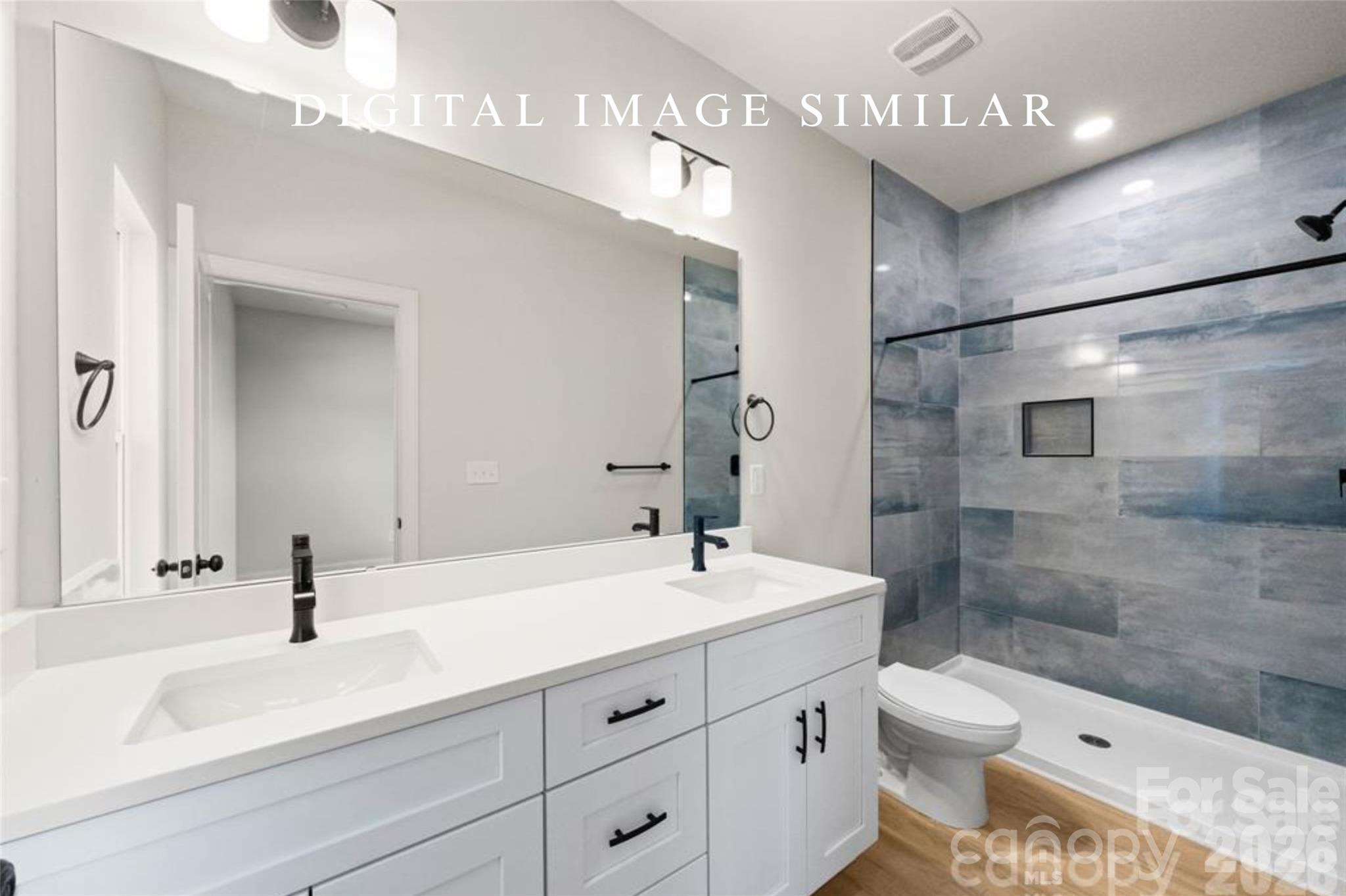 2928 Mulberry Church Road Charlotte, NC 28208 - Photo 34 of 43 a bathroom with a sink a toilet and shower