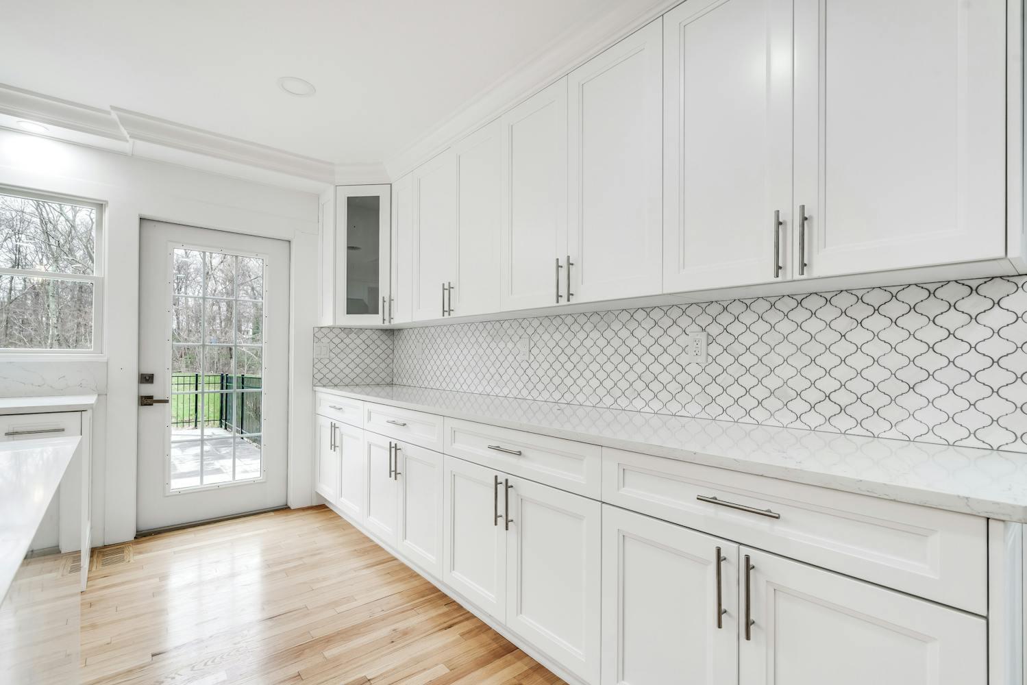 539 Split Rock Road Syosset, NY 11791 - Photo 13 of 40 a view of a kitchen with white cabinets