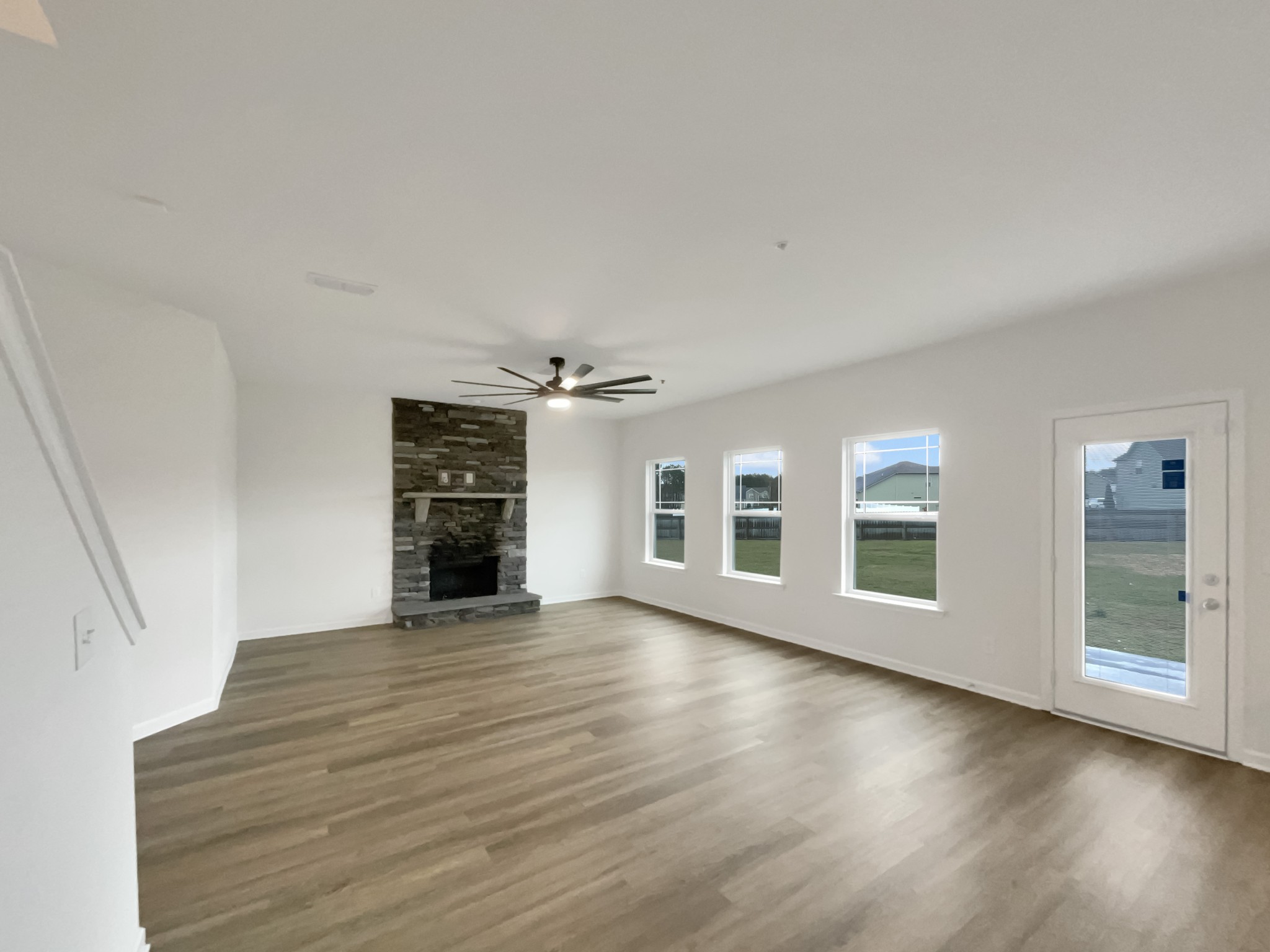 203 Fount Hackney Lane Murfreesboro, TN 37129 - Photo 3 of 26 wooden floor in an empty room with a window