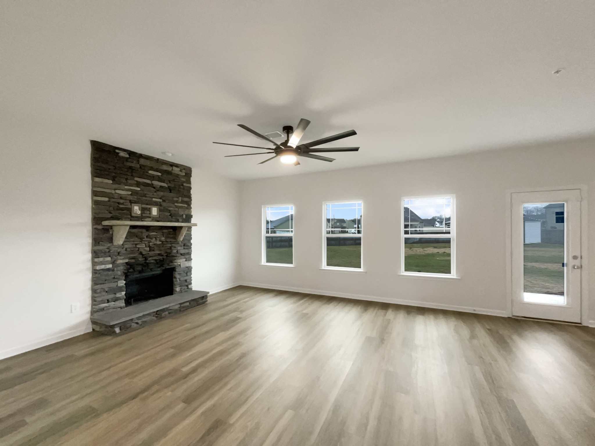 203 Fount Hackney Lane Murfreesboro, TN 37129 - Photo 9 of 26 wooden floor in an empty room with a window