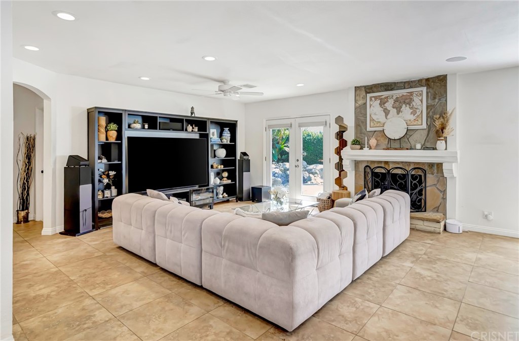 6720 Kurl Way Reseda, CA 91335 - Photo 12 of 40 a living room with furniture a flat screen tv and a fireplace