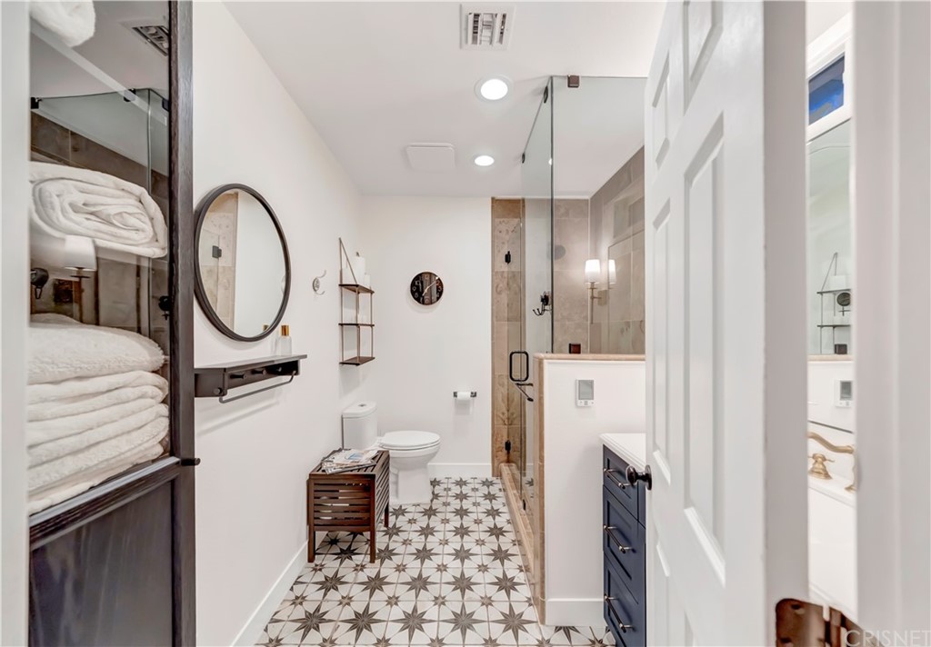 6720 Kurl Way Reseda, CA 91335 - Photo 13 of 40 a bathroom with a toilet a sink and a mirror