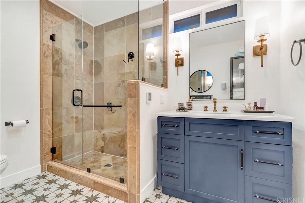 6720 Kurl Way Reseda, CA 91335 - Photo 15 of 40 a bathroom with a sink mirror and shower