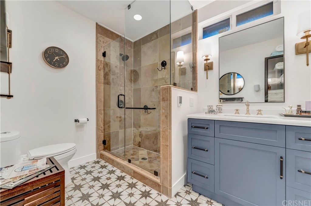 6720 Kurl Way Reseda, CA 91335 - Photo 16 of 40 a bathroom with a sink mirror and shower