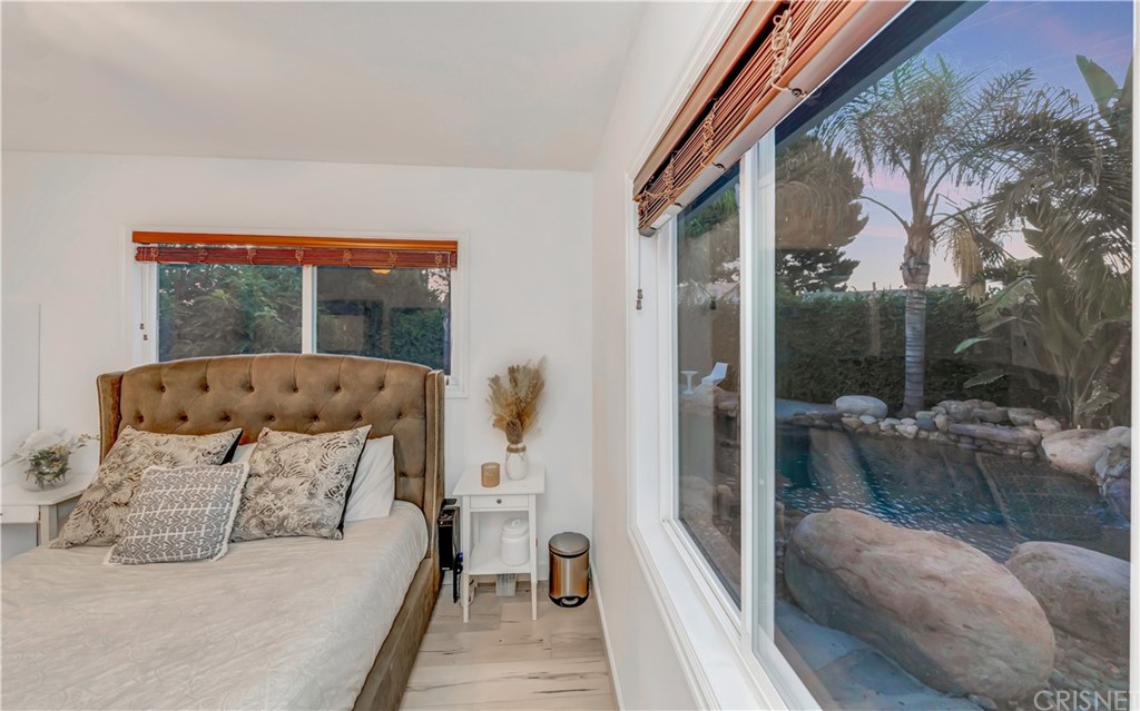 6720 Kurl Way Reseda, CA 91335 - Photo 18 of 40 a bedroom with a bed and a large window with outer view