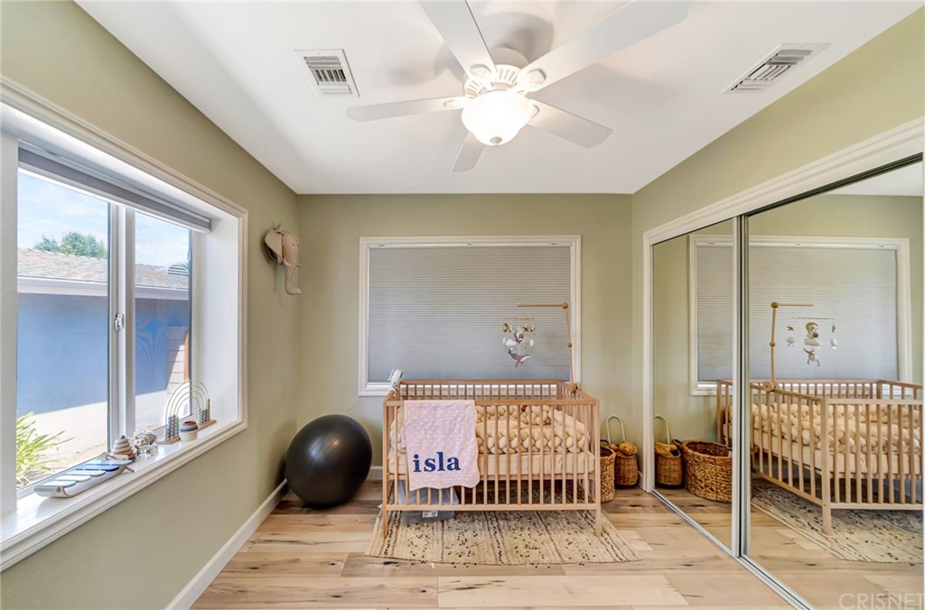 6720 Kurl Way Reseda, CA 91335 - Photo 22 of 40 a bedroom with a bed and a window