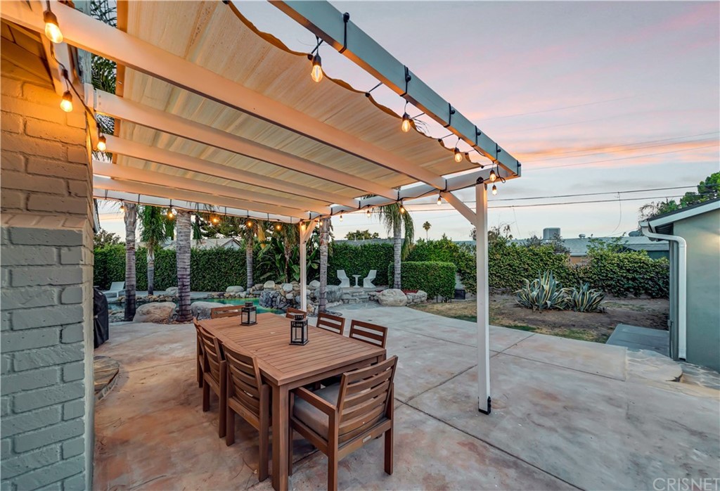 6720 Kurl Way Reseda, CA 91335 - Photo 35 of 40 a view of a patio with a table and chairs under an umbrella