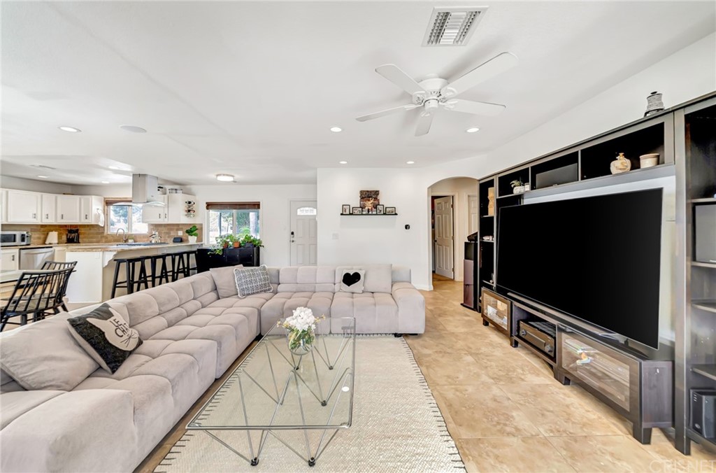 6720 Kurl Way Reseda, CA 91335 - Photo 10 of 40 a living room with furniture and a flat screen tv