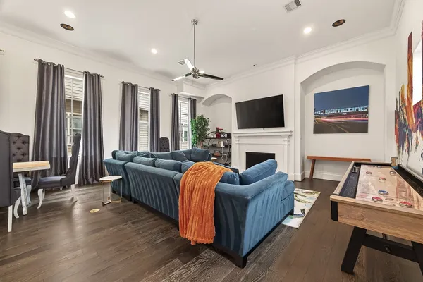 a living room with furniture fireplace and flat screen tv