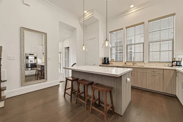 a kitchen with a sink stove and cabinets