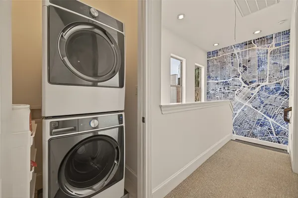 a view of a hallway with washer and dryer