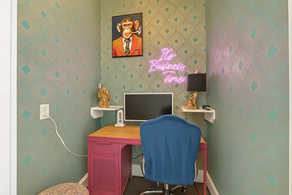 a view of a workspace with furniture