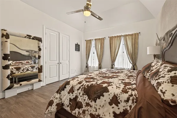 a bedroom with a bed and a television