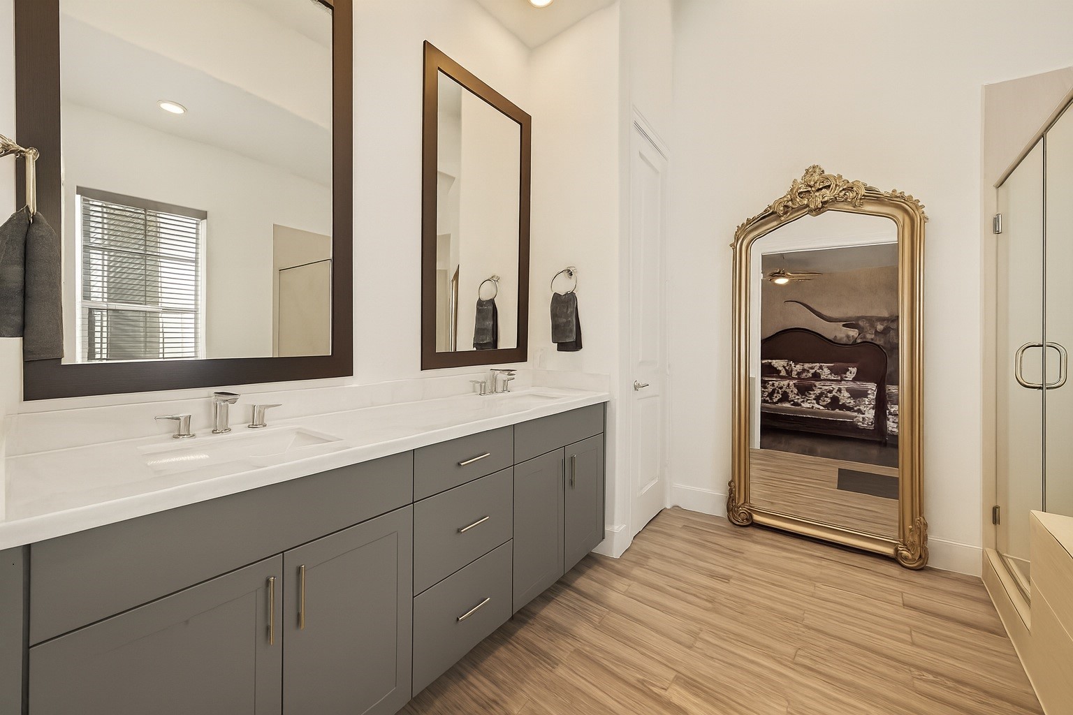 2506 McKinney Street Houston, TX 77003 - Photo 33 of 37 a bathroom with a double vanity sink and mirror