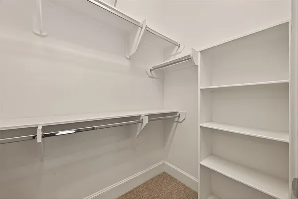 a view of an empty walk in closet