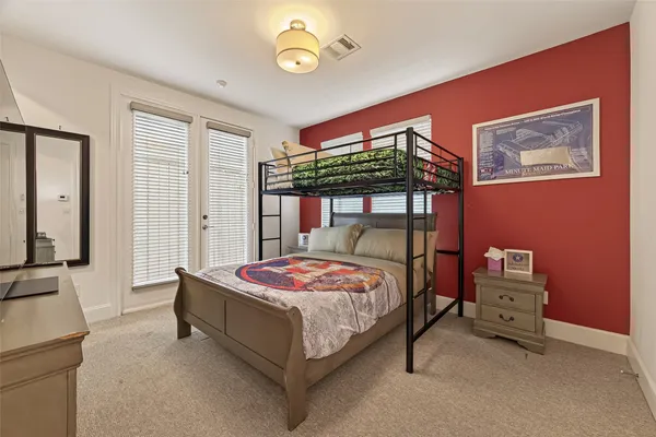 a bedroom with a bed and a table