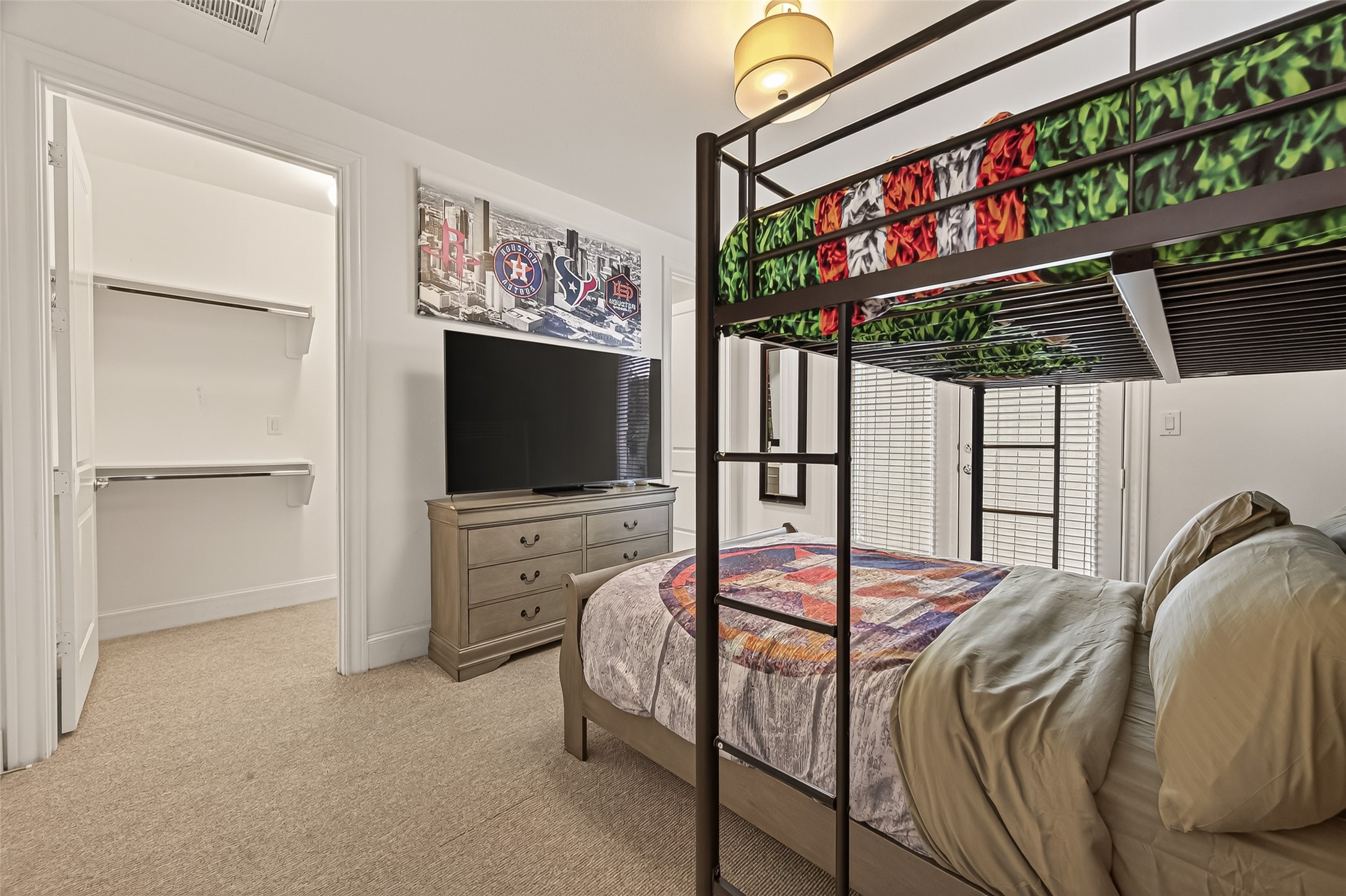 2506 McKinney Street Houston, TX 77003 - Photo 8 of 37 a bedroom with furniture and a flat screen tv