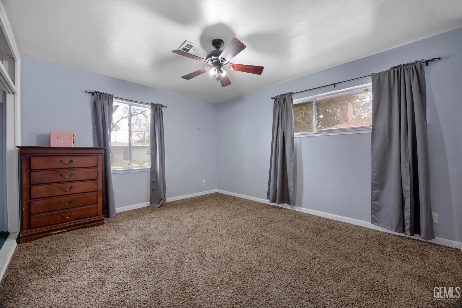 Undisclosed Address Bakersfield, CA 93305 - Photo 18 of 33 wooden floor in an empty room with a window