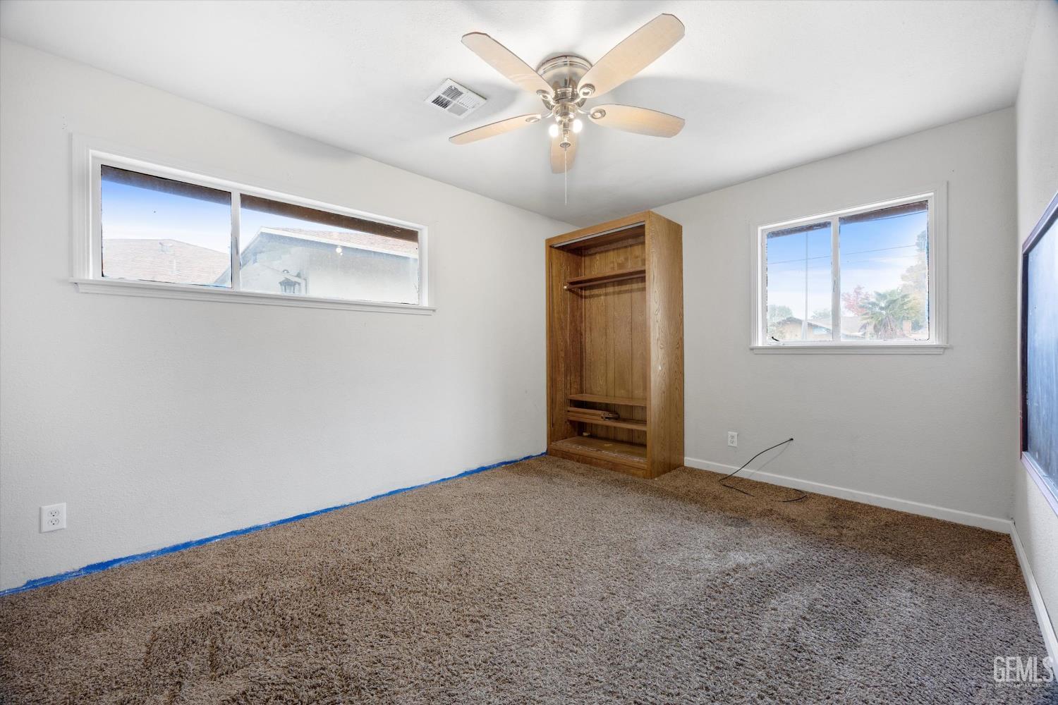 Undisclosed Address Bakersfield, CA 93305 - Photo 20 of 33 a view of an empty room with a window