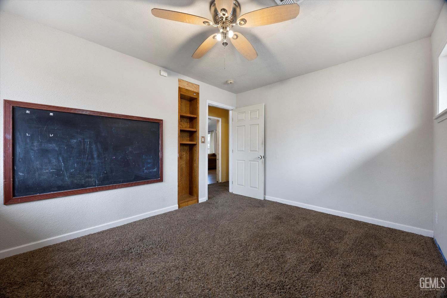 Undisclosed Address Bakersfield, CA 93305 - Photo 21 of 33 a view of a livingroom with a ceiling fan and chandelier fan