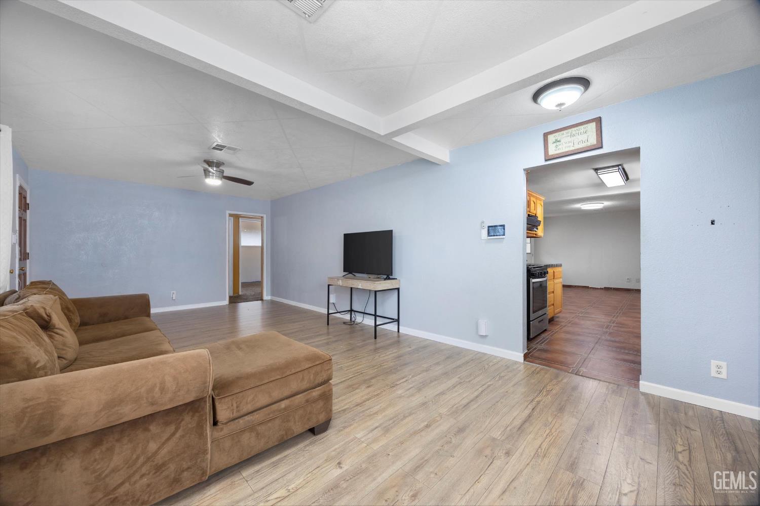 Undisclosed Address Bakersfield, CA 93305 - Photo 5 of 33 a living room with furniture and a flat screen tv