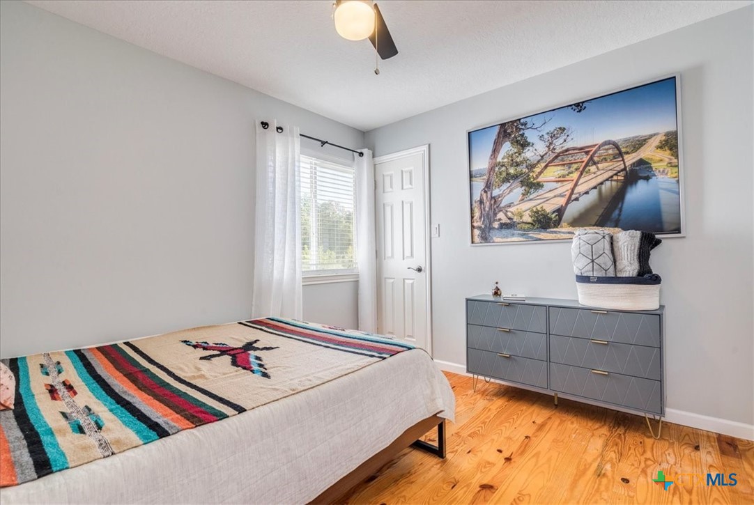 171 Pin Oak Crossing Elgin, TX 78621 - Photo 24 of 38 a bed room with a bed and a television
