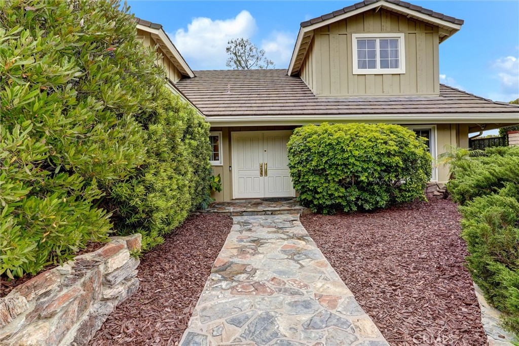 19238 Castlebay Lane Porter Ranch, CA 91326 - Photo 38 of 38 a view of a house with a small yard and plants