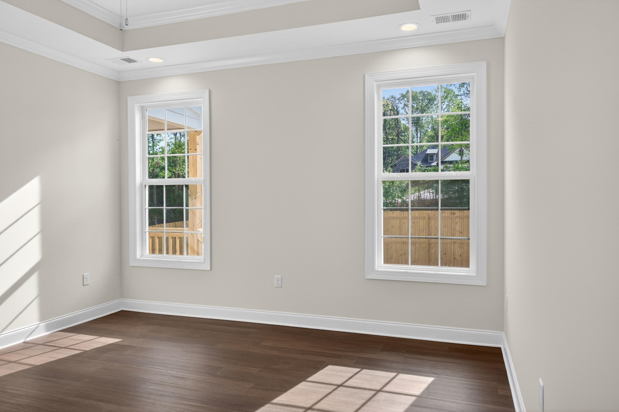 413 Haig Ml Lk Road, Unit 5 Dalton, GA 30720 - Photo 15 of 50 an empty room with wooden floor and windows