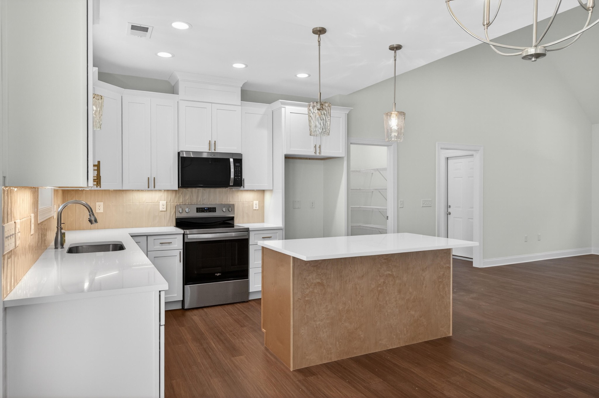 413 Haig Ml Lk Road, Unit 5 Dalton, GA 30720 - Photo 20 of 50 a kitchen with kitchen island a sink stainless steel appliances and cabinets