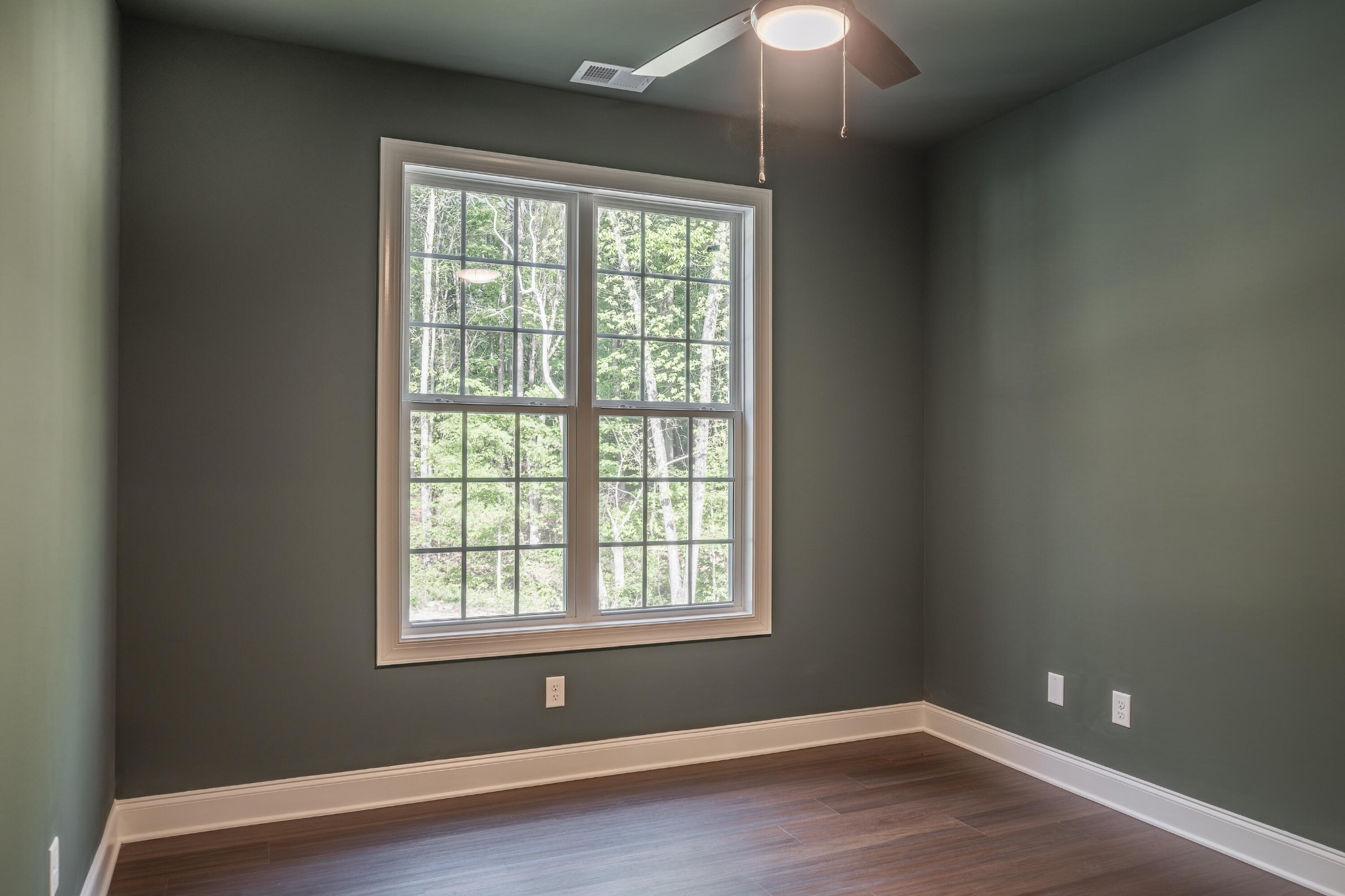413 Haig Ml Lk Road, Unit 5 Dalton, GA 30720 - Photo 27 of 50 an empty room with wooden floor and windows