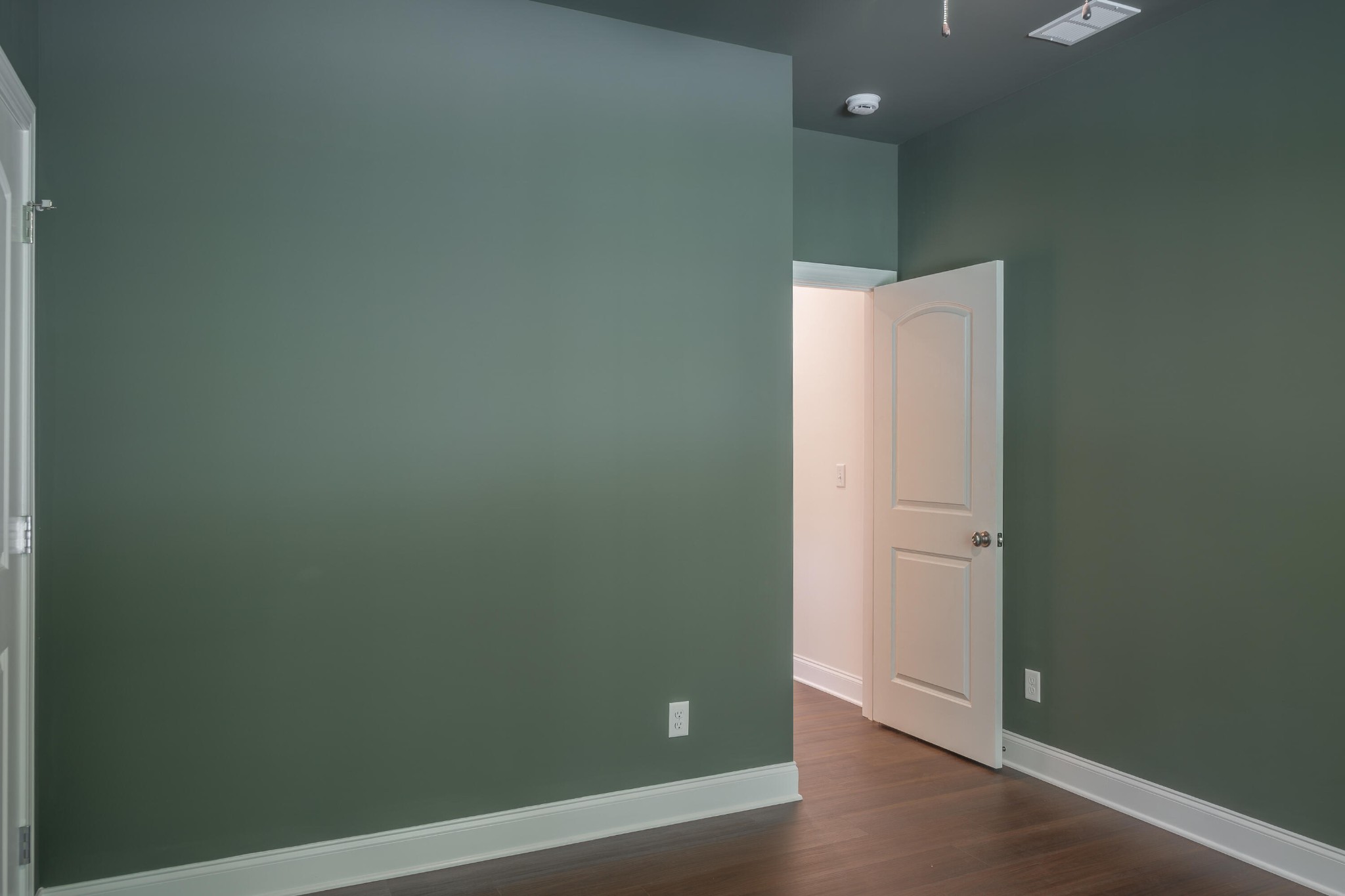 413 Haig Ml Lk Road, Unit 5 Dalton, GA 30720 - Photo 29 of 50 an empty room with wooden floor