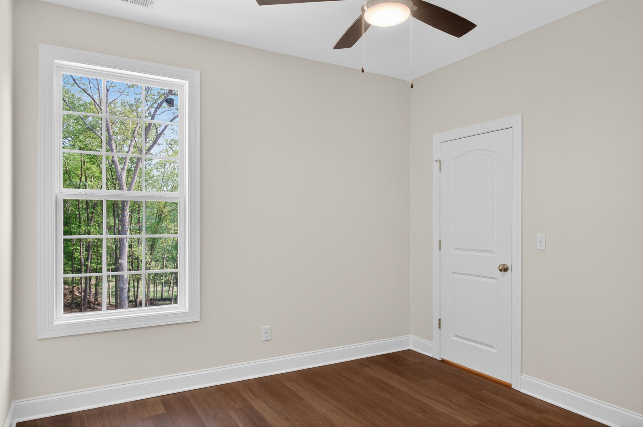 413 Haig Ml Lk Road, Unit 5 Dalton, GA 30720 - Photo 32 of 50 an empty room with a window and wooden floor