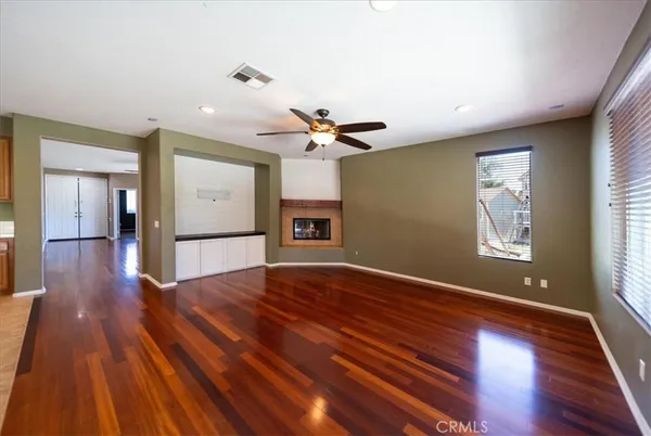 a view of a kitchen with a stove cabinets and a wooden floor