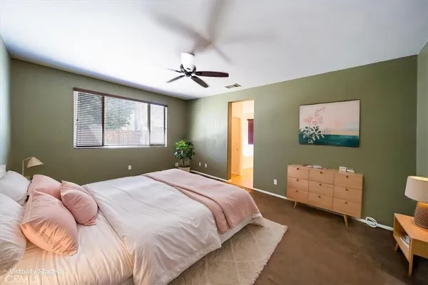 a view of an empty room with windows
